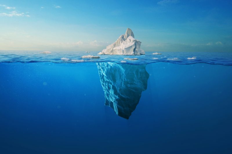 Amazing,White,Iceberg,Floats,In,The,Ocean,With,A,View